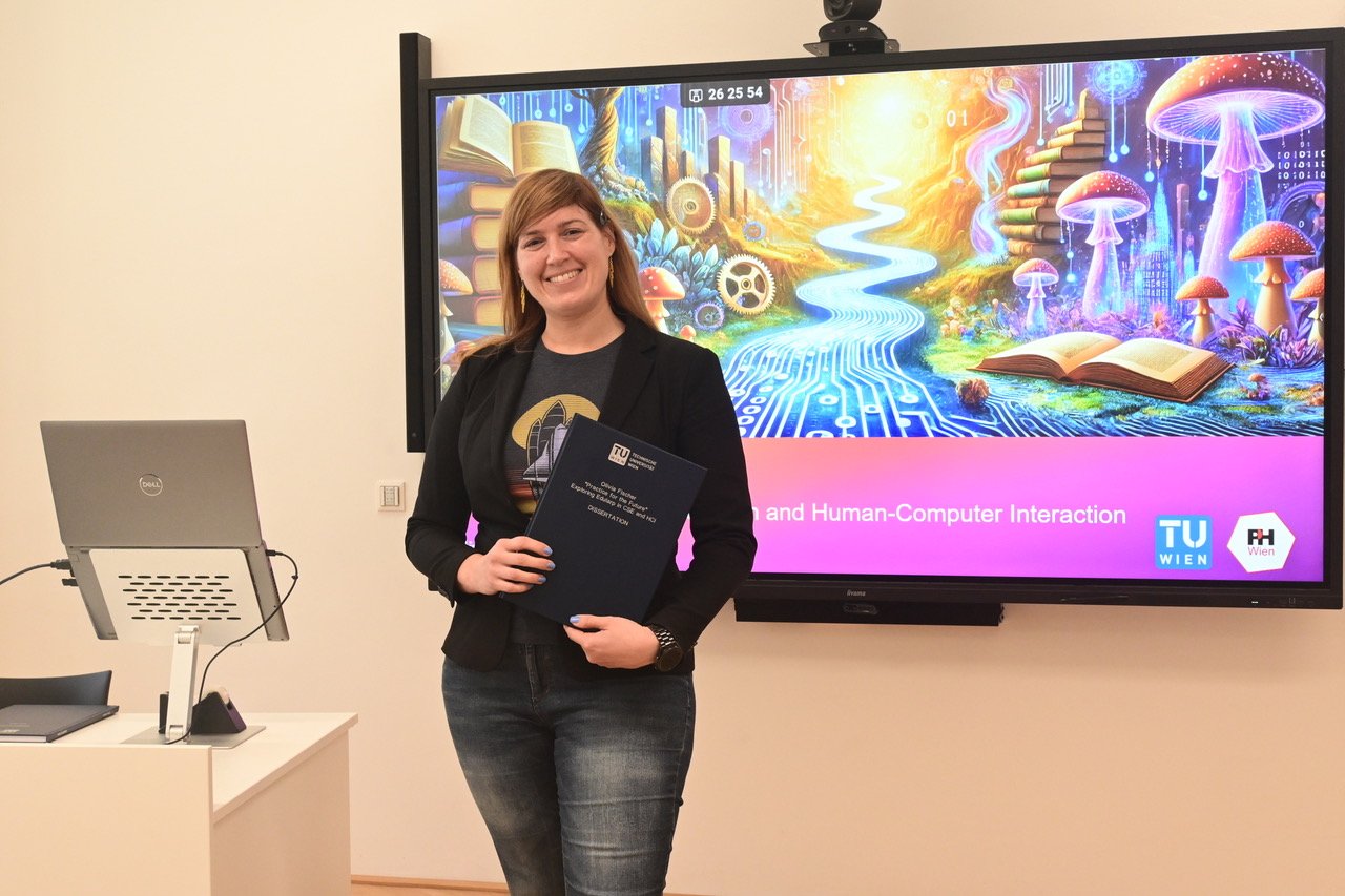 Olivia Fischer holding her dissertation in front of her presentation